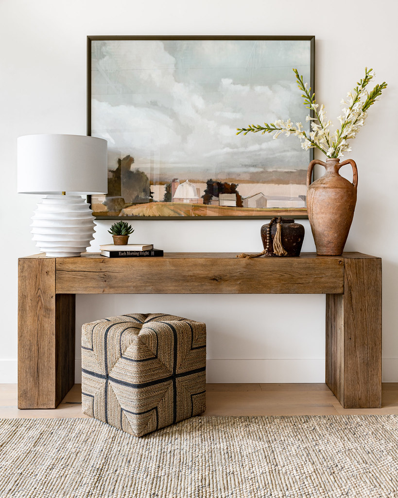 Styled wall with wallpaper and decor